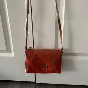 NWT Dooney and Bourke bag. Never been used. Red and brown